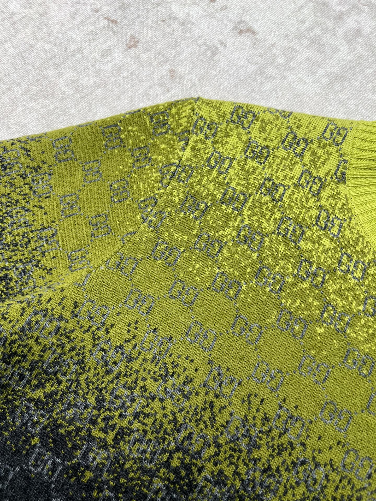 Yellow knit sweater with GG logo pattern and ribbed neckline