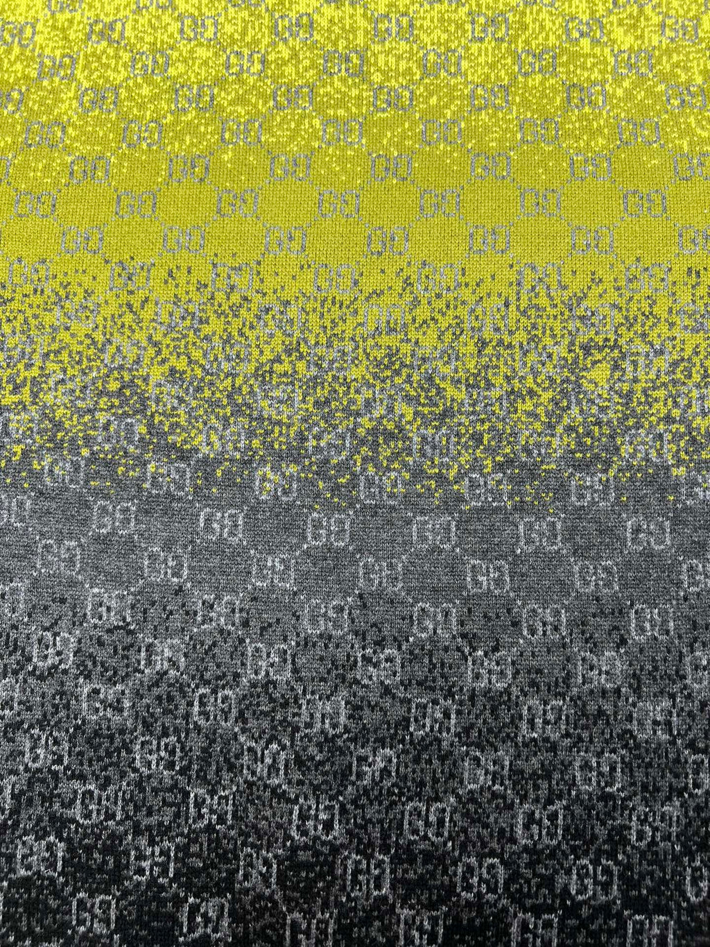 Yellow and dark gradient knit sweater with GG logo pattern close-up