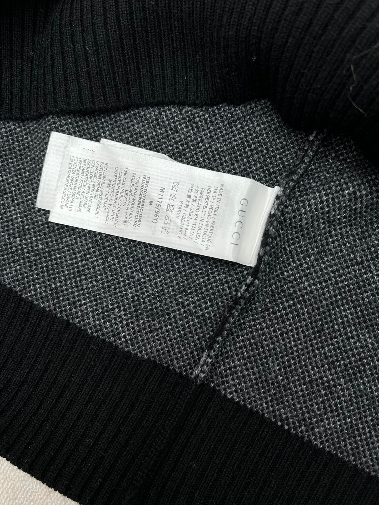 Sweater interior neck with size and care label tag