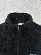 Dior black sherpa jacket close-up with front zipper and stand collar