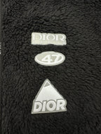 Dior black sherpa jacket with embroidered “Dior” logo and tag patches