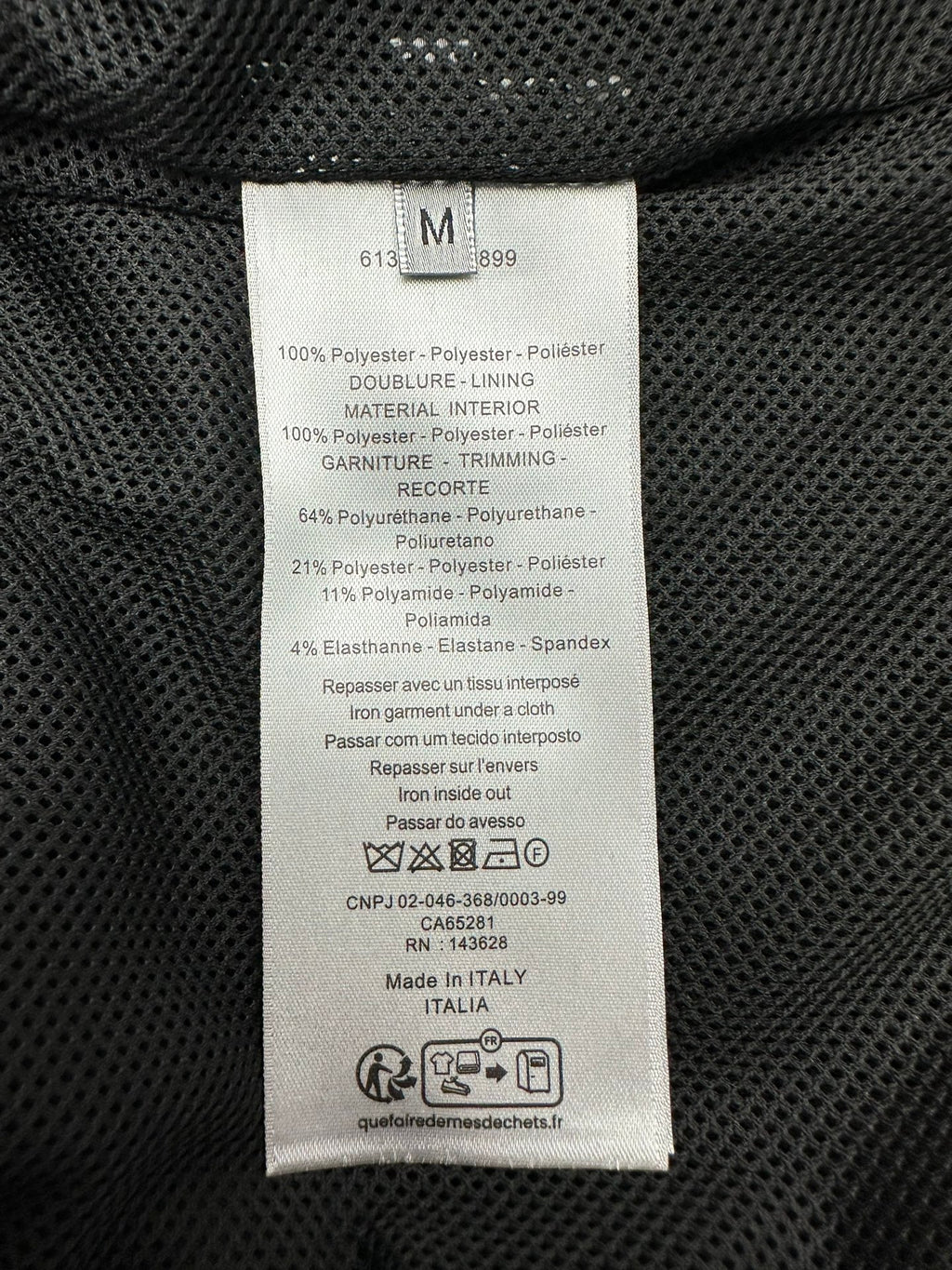 Dior jacket interior care label on black fabric