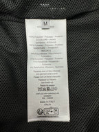 Dior jacket interior care label on black fabric