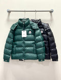 Moncler long puffer jacket, green front view on hanger with hood and zipper