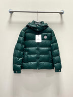 Moncler long puffer jacket, green front view with zipper and hood, on hanger