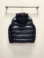 Moncler long puffer jacket, dark color back view with hood, on hanger