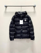 Moncler long puffer jacket, dark color front view with hood, on hanger