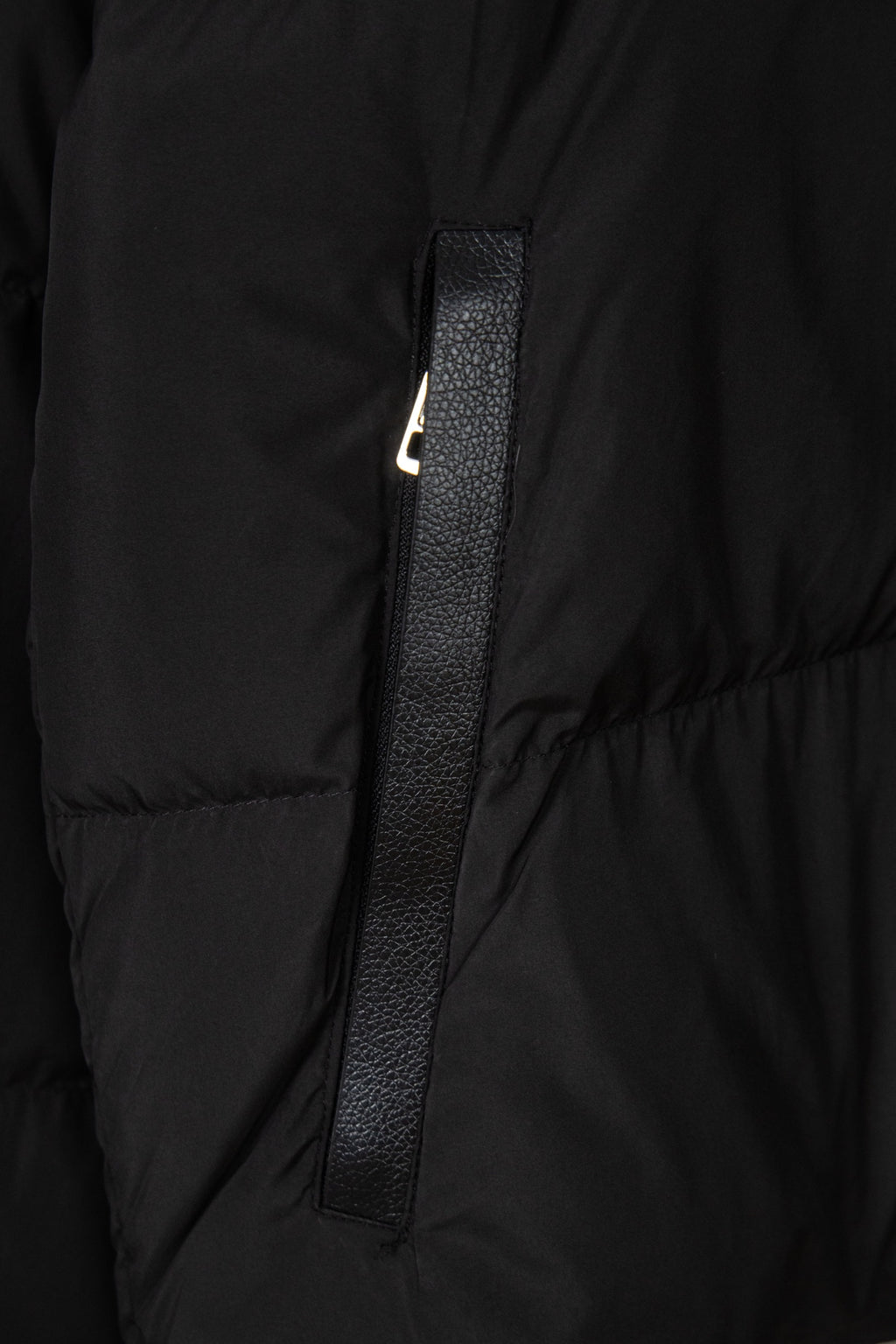 Black puffer jacket front with zipper placket and metal zipper pull detail