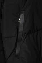 Black puffer jacket front with zipper placket and metal zipper pull detail