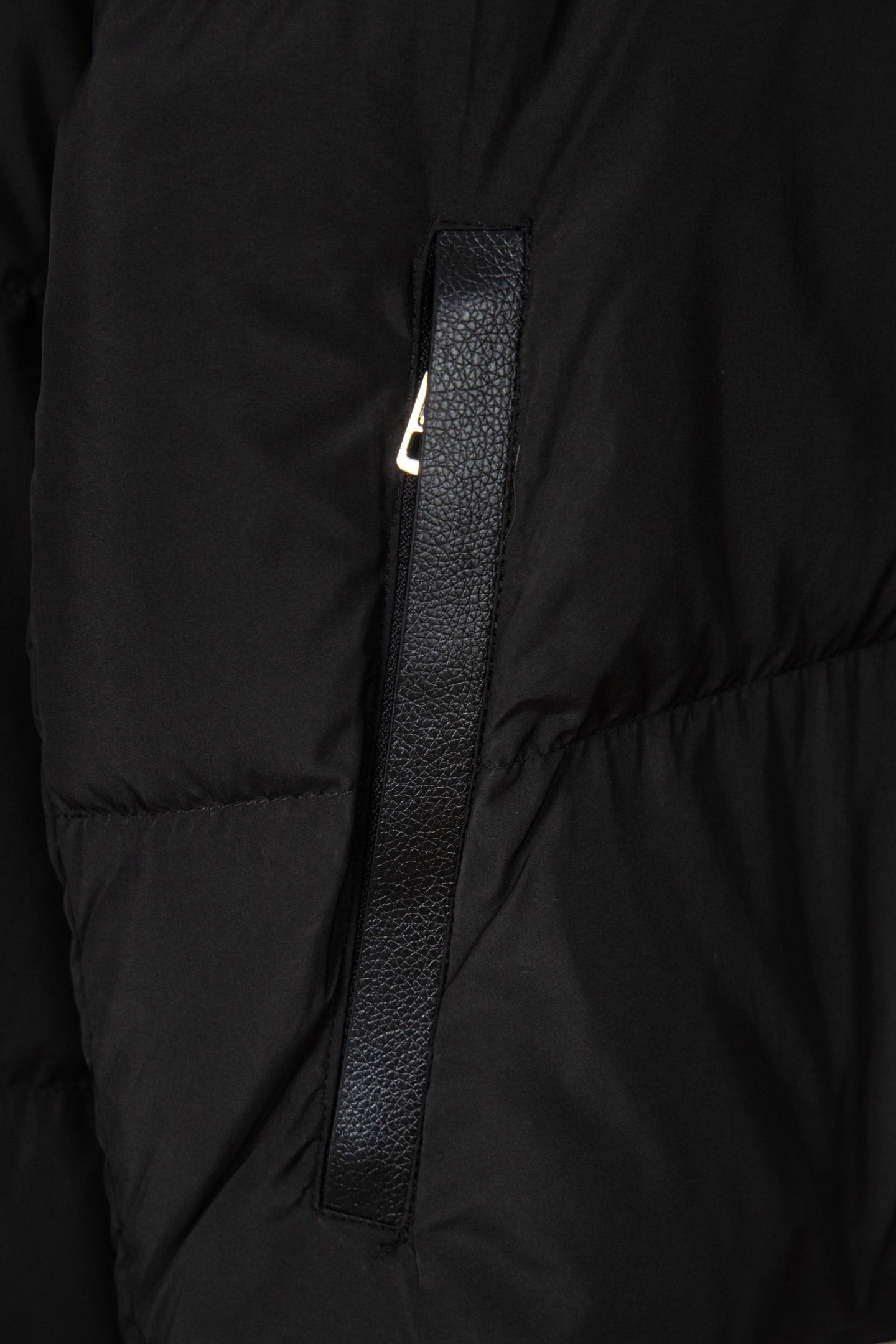 Black puffer jacket front with zipper placket and metal zipper pull detail