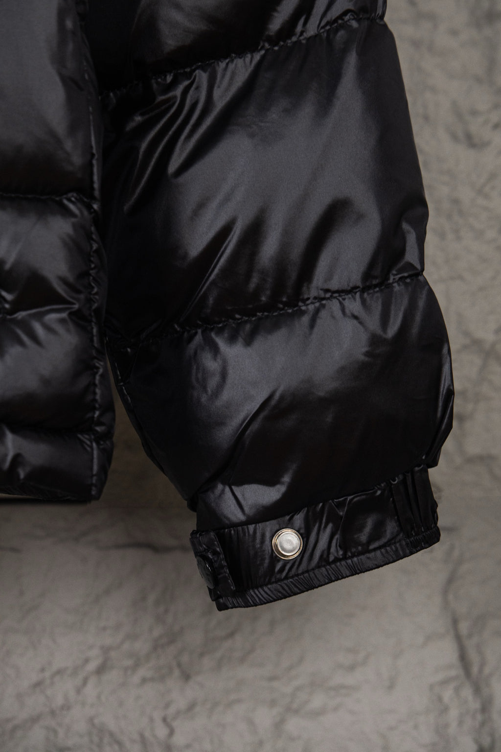 Moncler puffer jacket sleeve with snap cuff detail