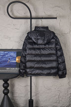 Moncler long hooded puffer jacket, dark, front view with hood