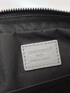 Louis Vuitton interior label on black lining inside zippered crossbody bag
