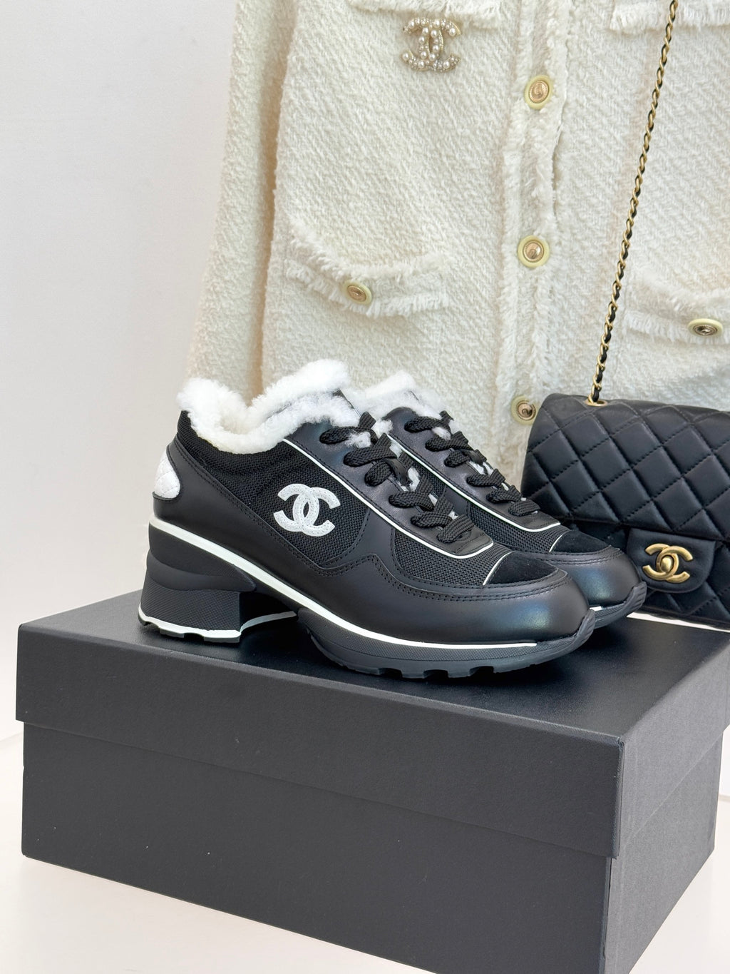 Chanel ladies sneakers, black with white logo accents and fuzzy white lining