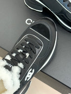 Chanel ladies sneakers side view, black mesh with white trim and lace-up