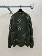 Dark green long-sleeve knit sweater with all-over logo pattern and ribbed crew neck