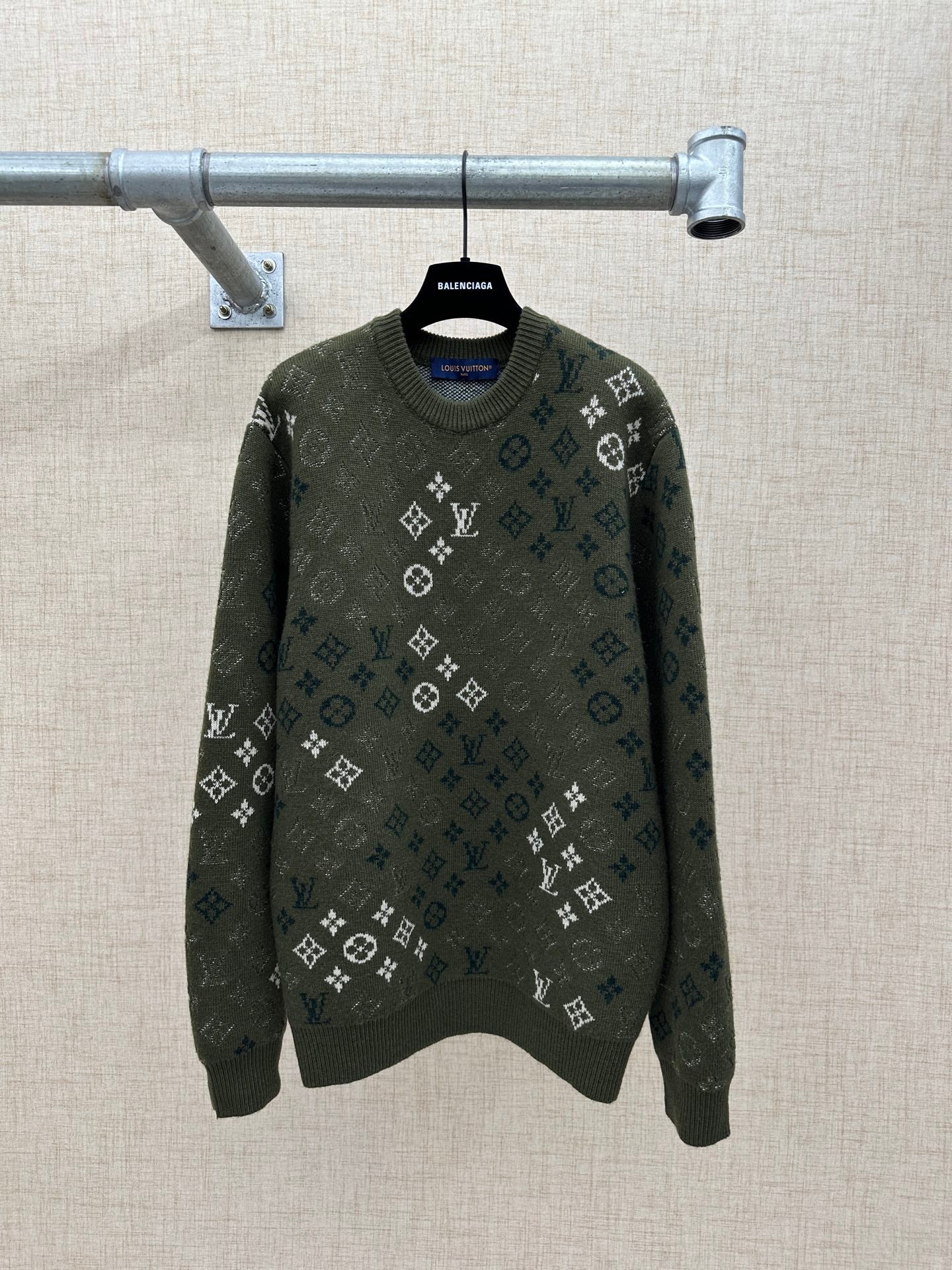Long-sleeve knit sweater in dark green with all-over logo pattern and crew neck