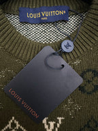 Louis Vuitton neck label and dark hang tag on a green knit sweater garment