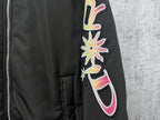 Dior black bomber jacket sleeve graphic patch with colorful flower and swirl details