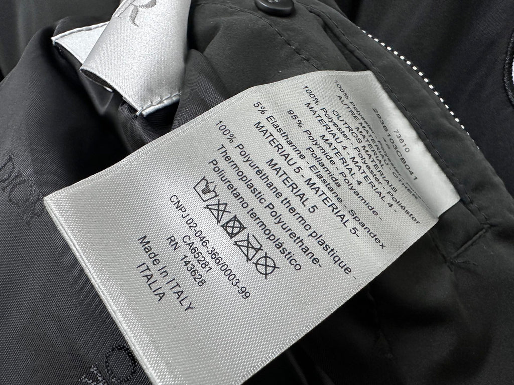 Dior black bomber jacket interior care label with fabric and material information tag
