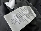 Dior black bomber jacket interior care label with fabric and material information tag