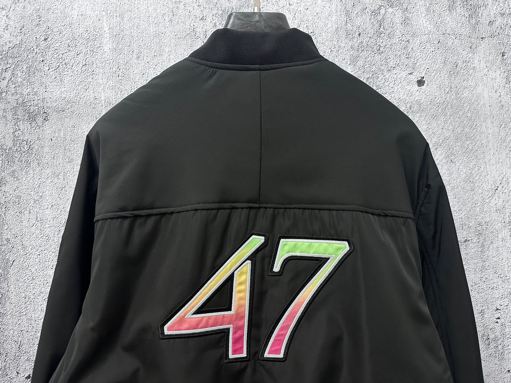 Dior black bomber jacket back view with large 47 graphic centered