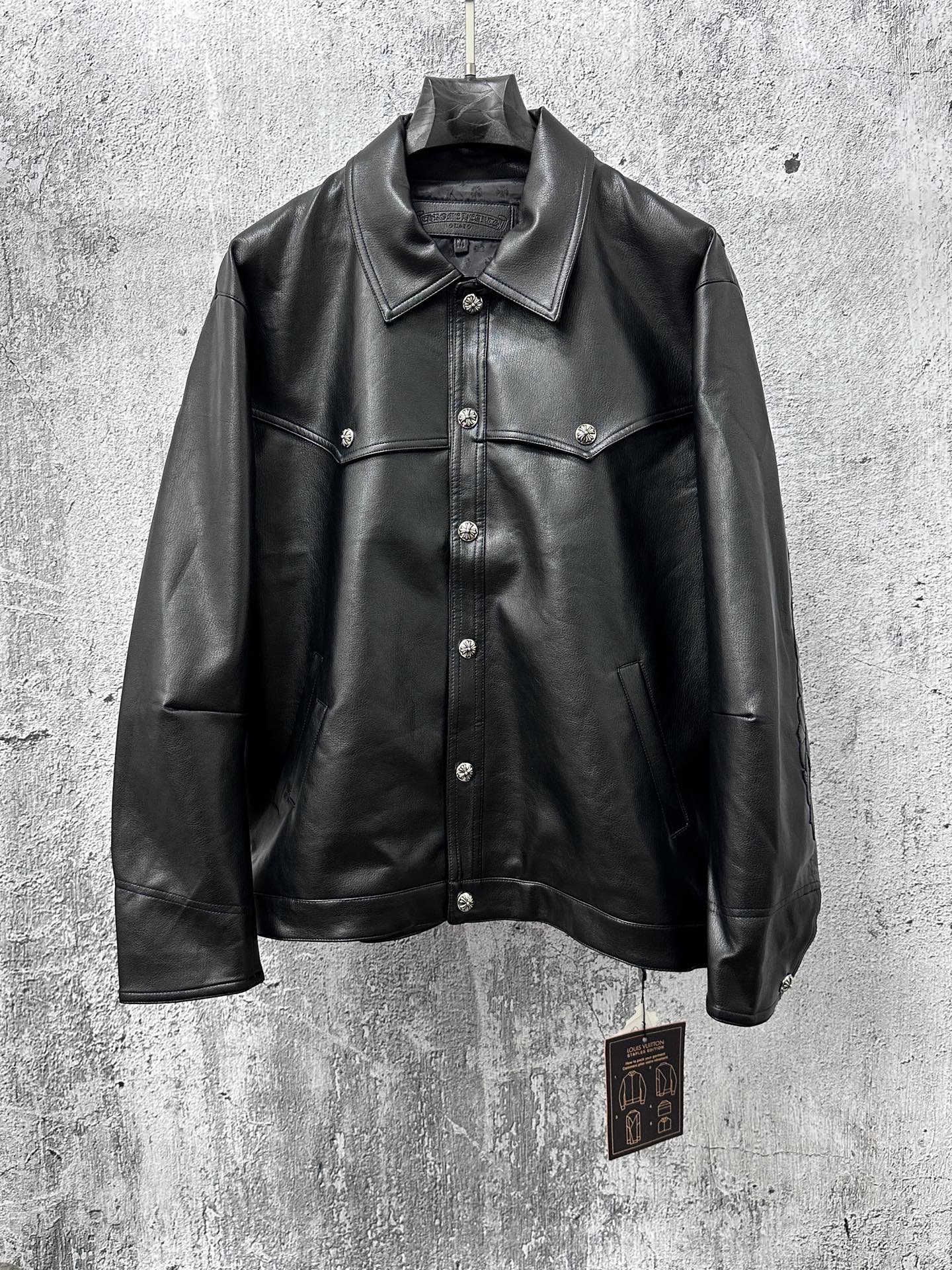 Dark leather jacket with spread collar, button front, and chest flap pockets.