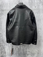 Dark leather jacket back view with curved yoke and long sleeves.