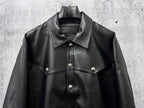 Dark leather jacket front view with button placket and chest yoke details.