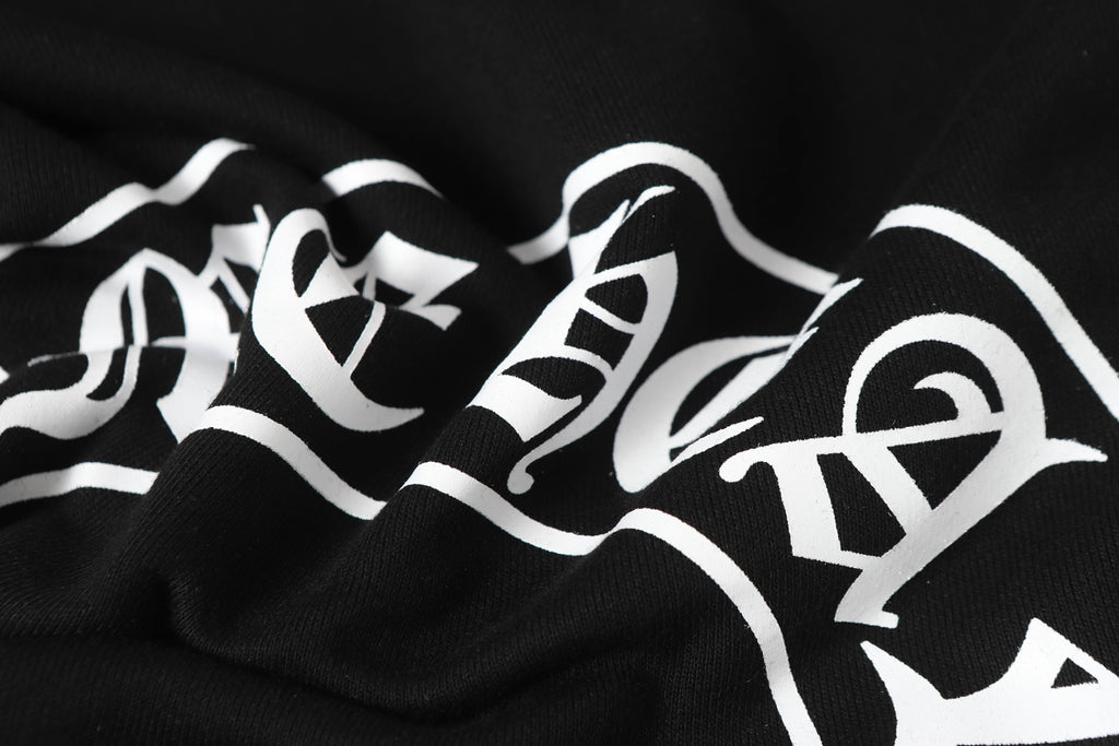Black hoodie with large white graphic lettering