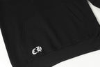 Black hoodie with small white logo on lower front hem
