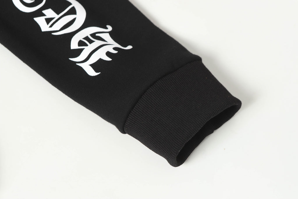 Black long-sleeve hoodie sleeve cuff with white graphic emblem