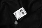 Black hoodie fabric with neck tag and small logo charm