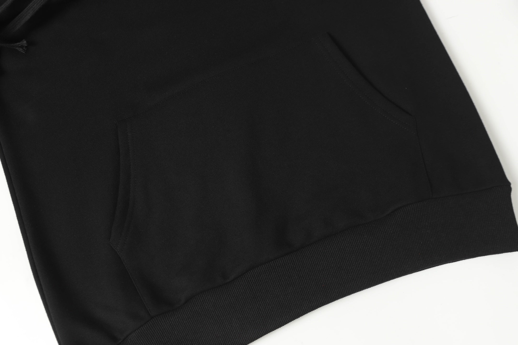 Black long-sleeve shirt with crew neck and seam details