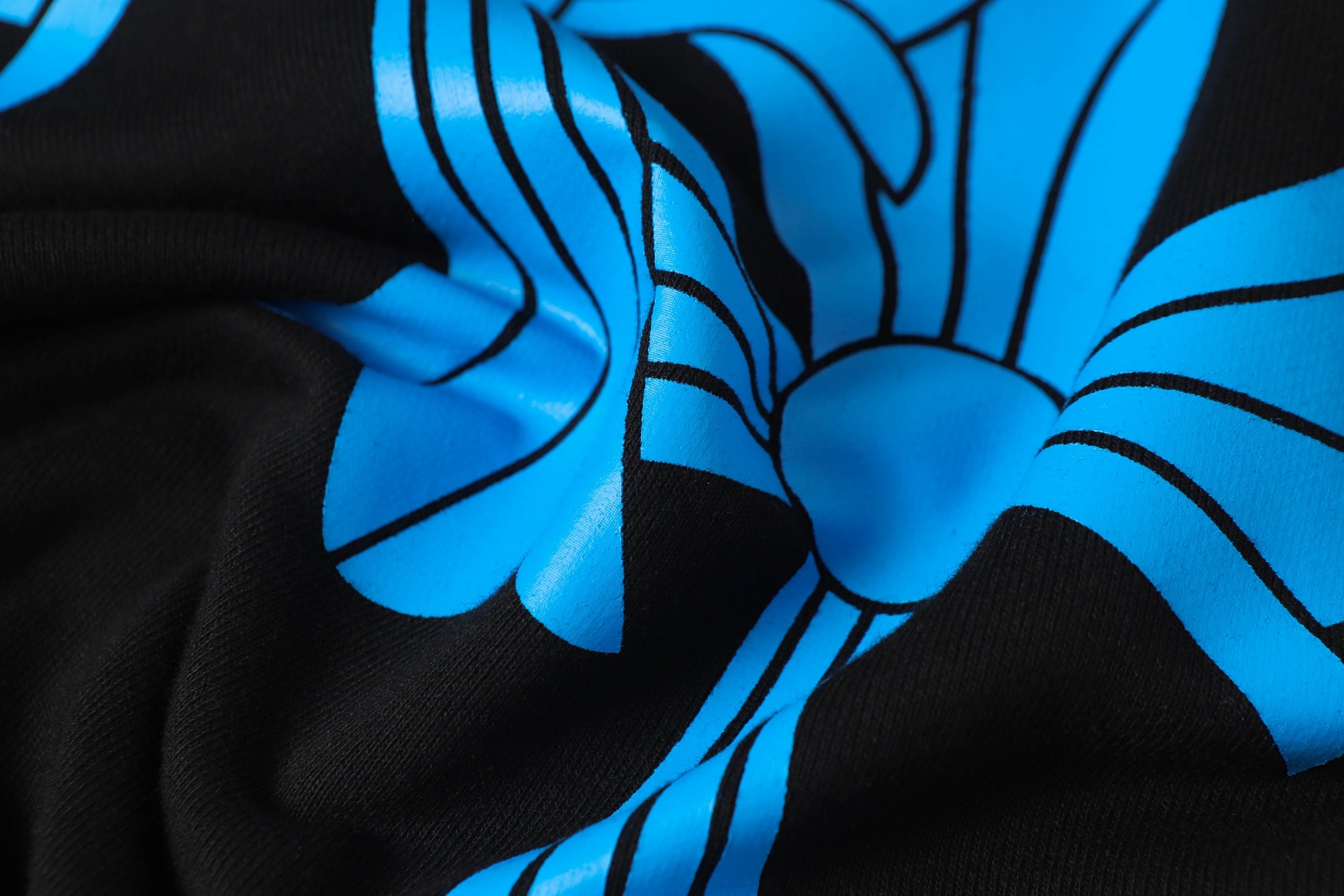 Black long-sleeve shirt with large blue graphic print