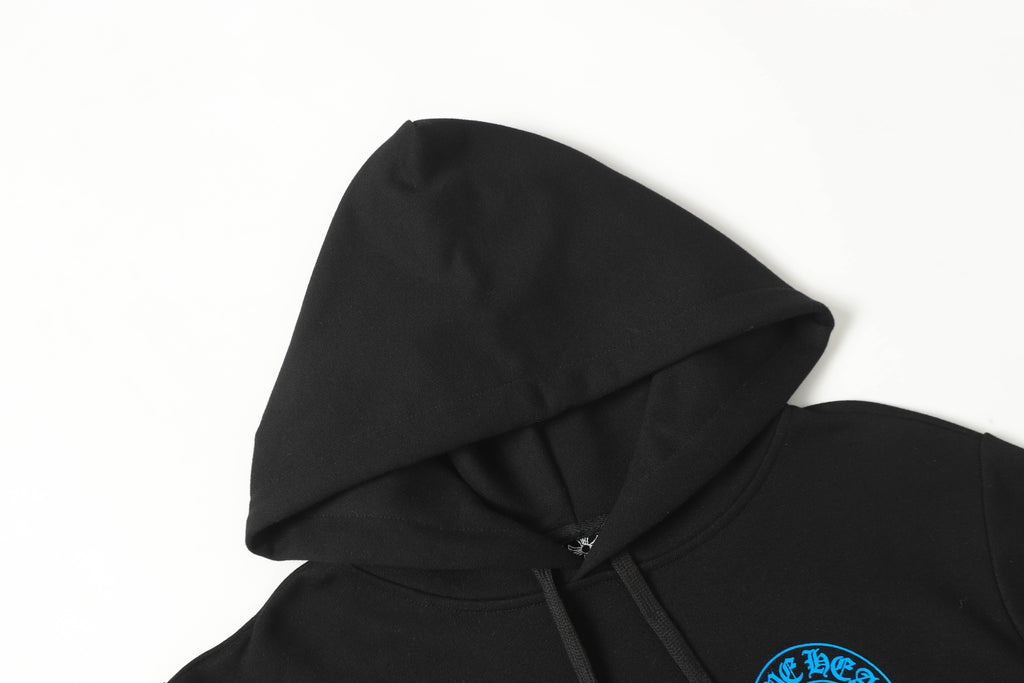 Black hoodie hood and neckline close-up with drawcords and partial blue emblem