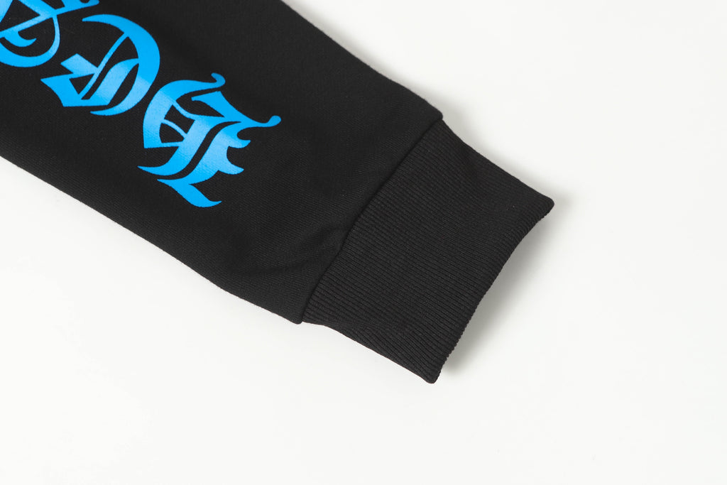 Black long-sleeve shirt sleeve cuff with blue logo print