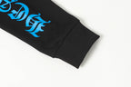 Black long-sleeve shirt sleeve cuff with blue logo print