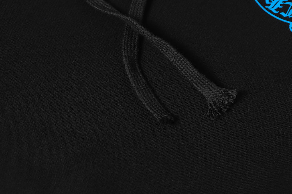 Black hoodie drawstring with woven texture and tassel close-up