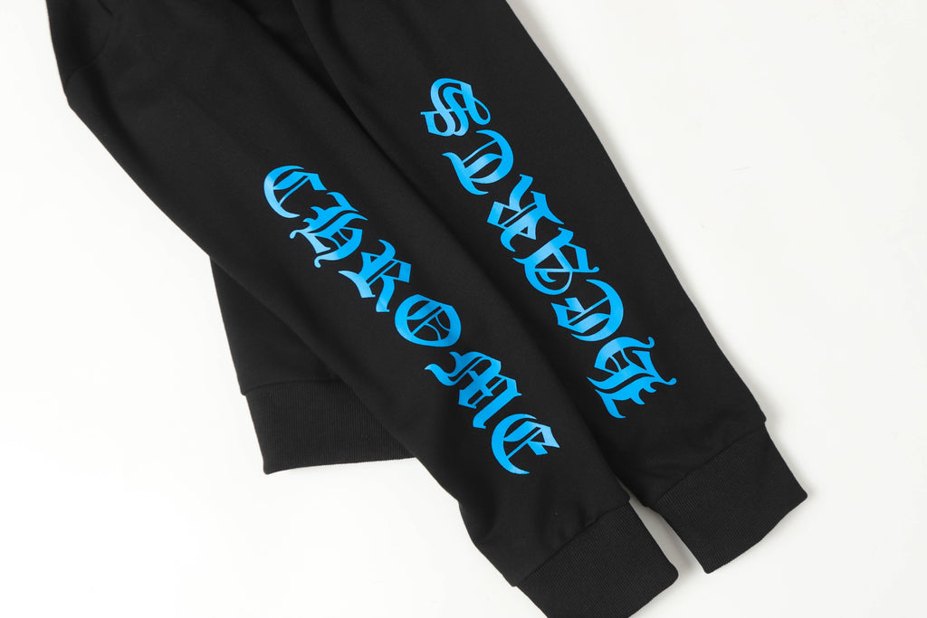 Black hoodie sleeve with blue vertical stylized text graphic close-up