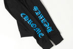 Black hoodie sleeve with blue vertical stylized text graphic close-up