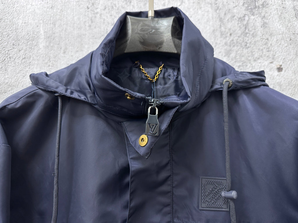 Hooded jacket upper front with zip placket and patch pocket, dark navy blue.