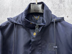 Hooded jacket upper front with zip placket and patch pocket, dark navy blue.