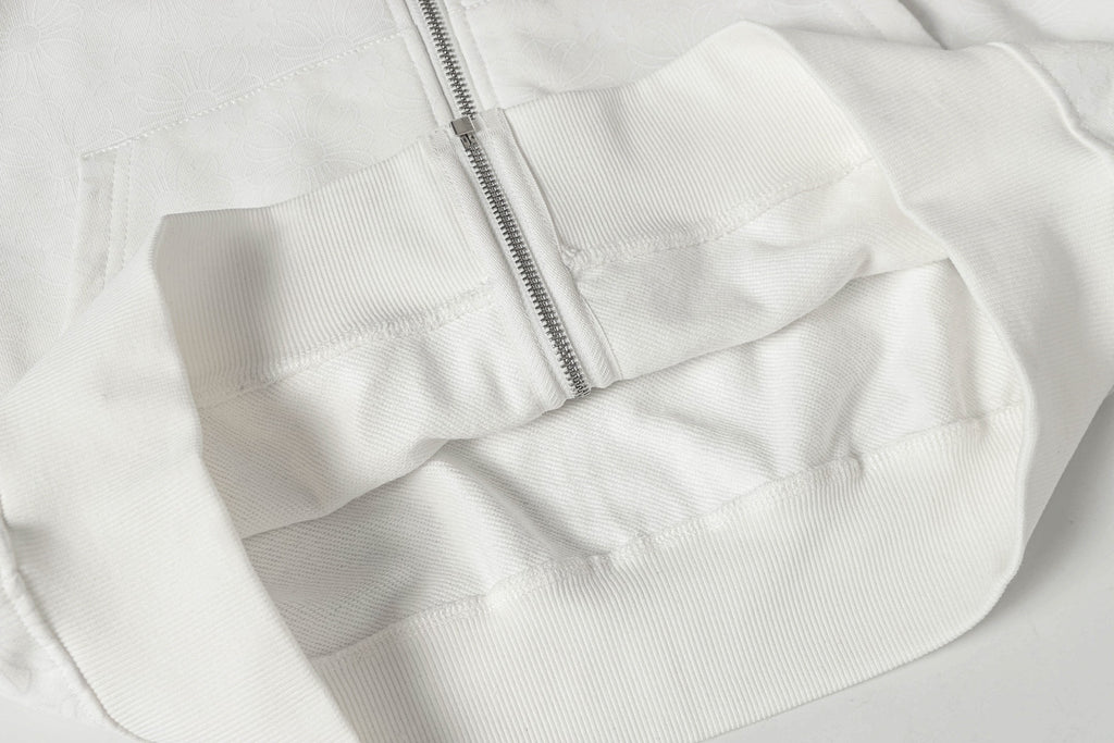 White zip-up hoodie with front zipper and stitched yoke panel