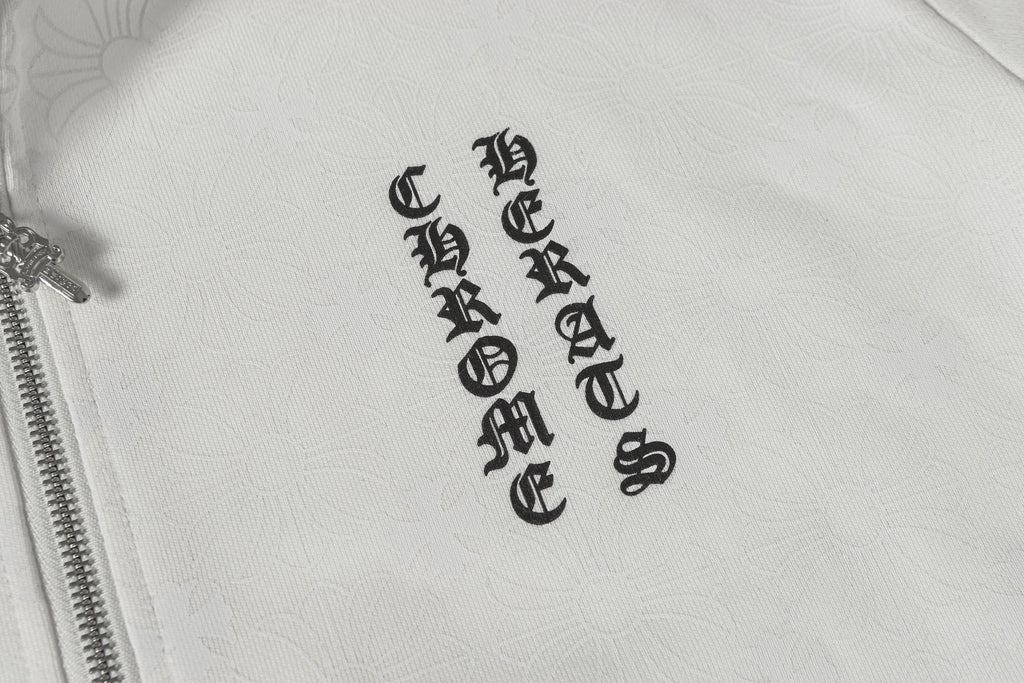 Chrome long hoodie chest emblem and patterned fabric texture close-up
