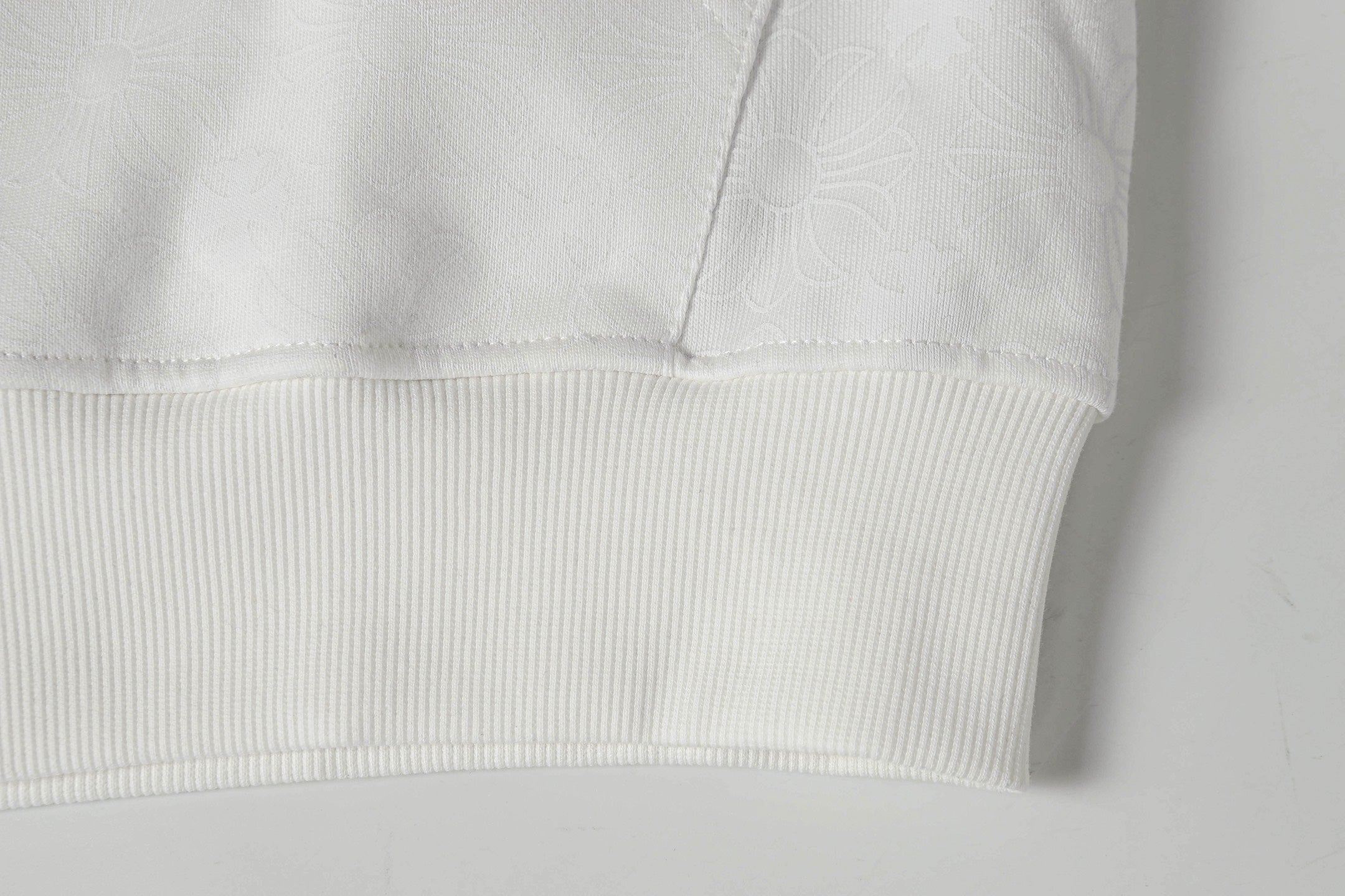 White ribbed hem and cuff detail on zip-up hoodie