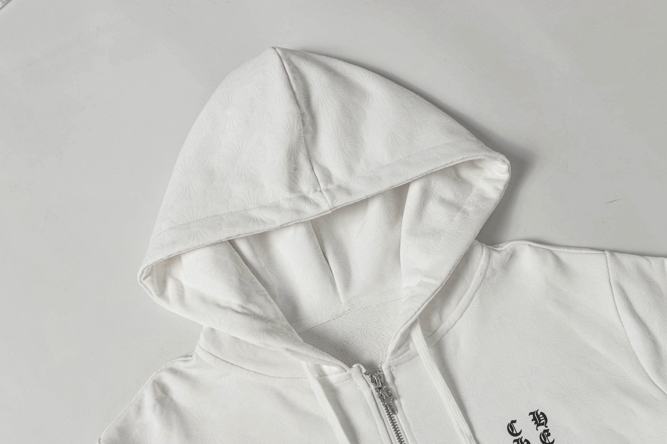 Chrome long hoodie hood close-up with drawstring and front zipper seam