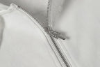 Chrome long hoodie front zipper close-up with metal teeth and top stop
