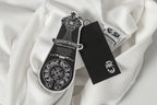 White zip-up hoodie with printed sleeve crest patch and black care tag