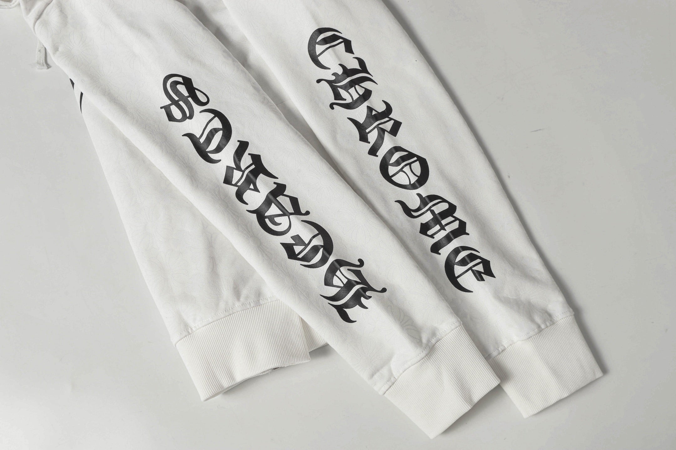Chrome long hoodie sleeve graphic text print on white fabric